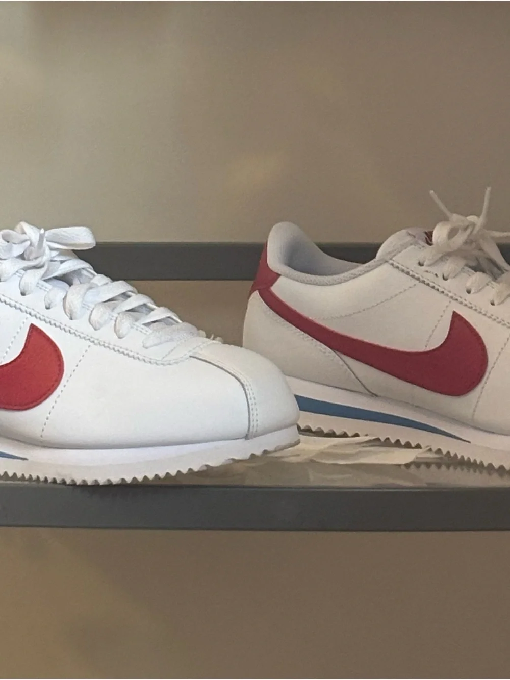 Nike White Athletic Sneakers with Red Swoosh